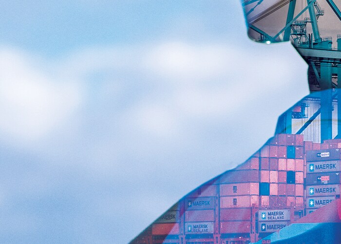 Maersk employee and Maersk shipping containers