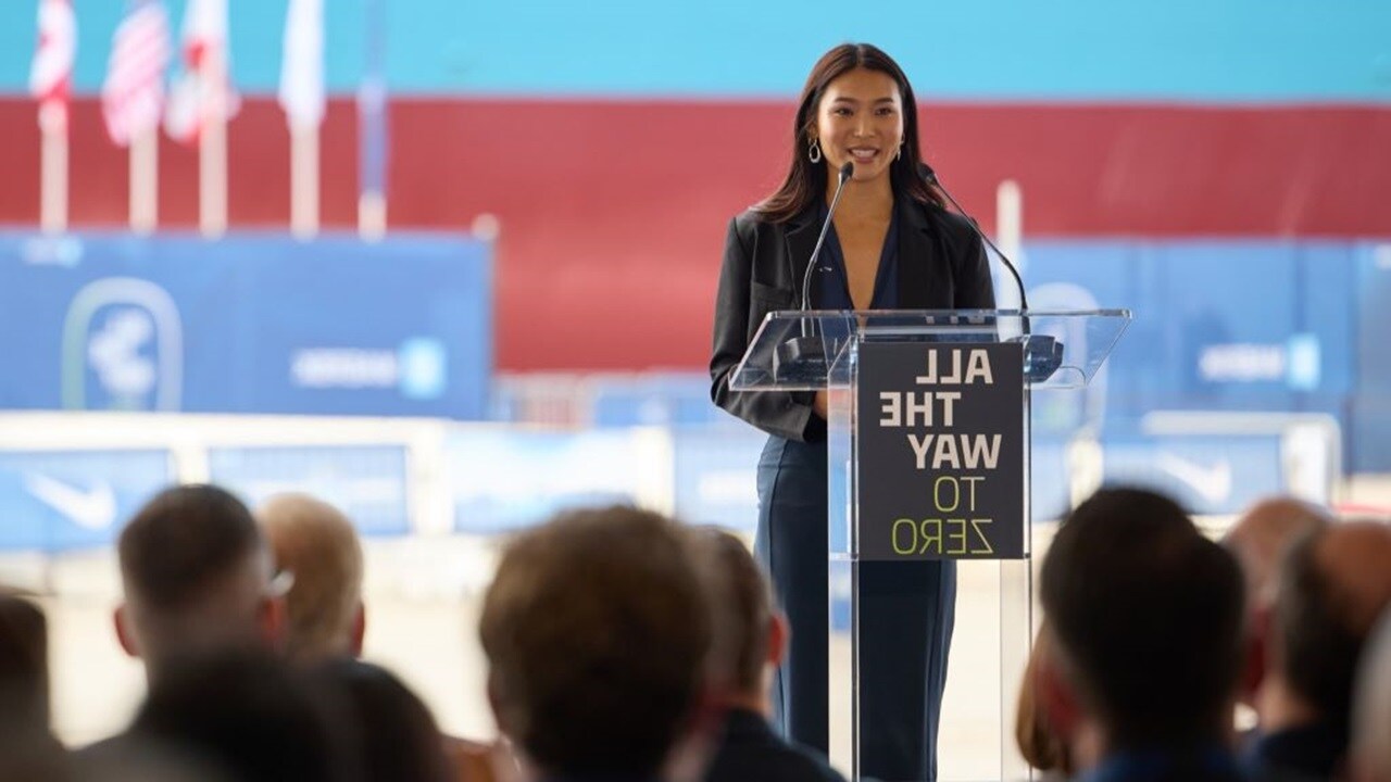 Women employee on the stage infront of mike