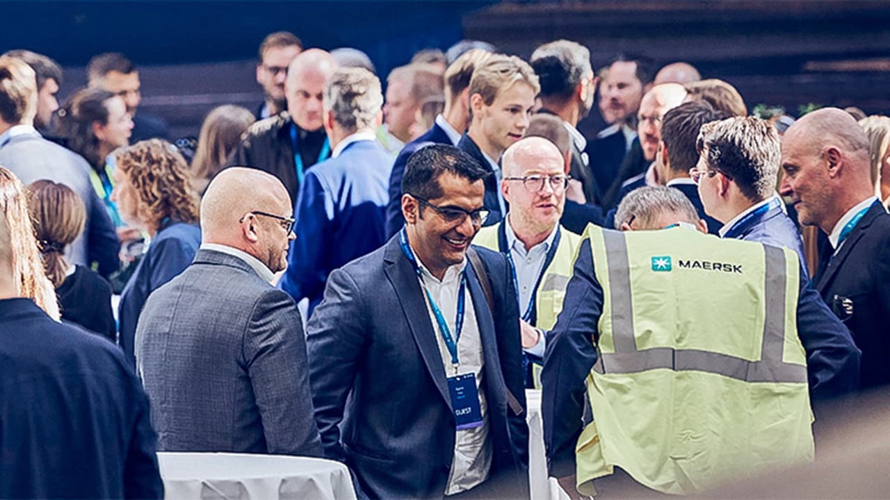 Group of people networking at an stakeholder engagement event