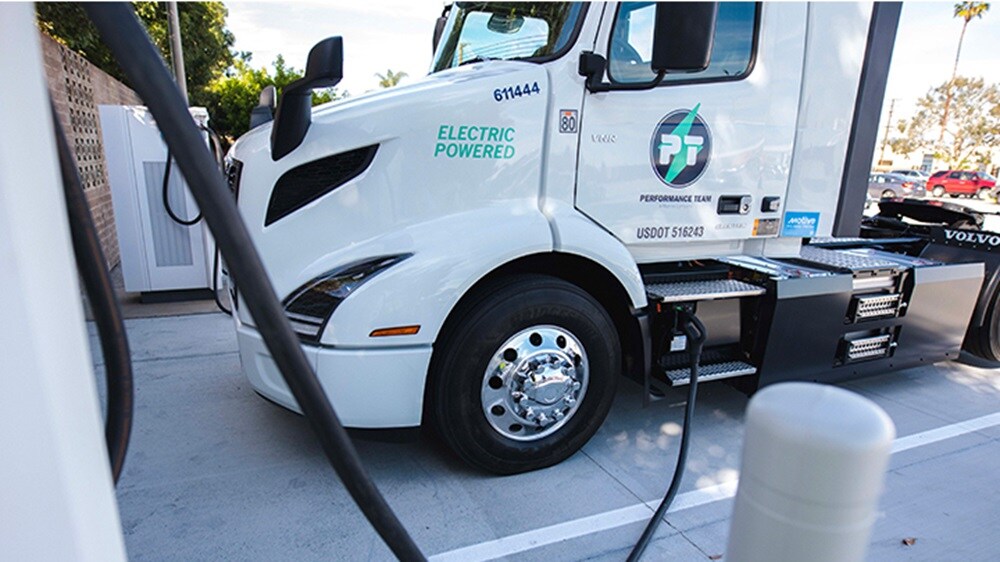 Performance Team Electric truck at Santa Fe Springs warehouse in california parked and charging.