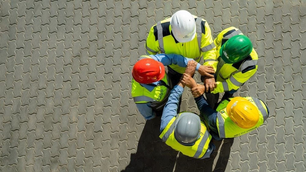 Employees holding hands