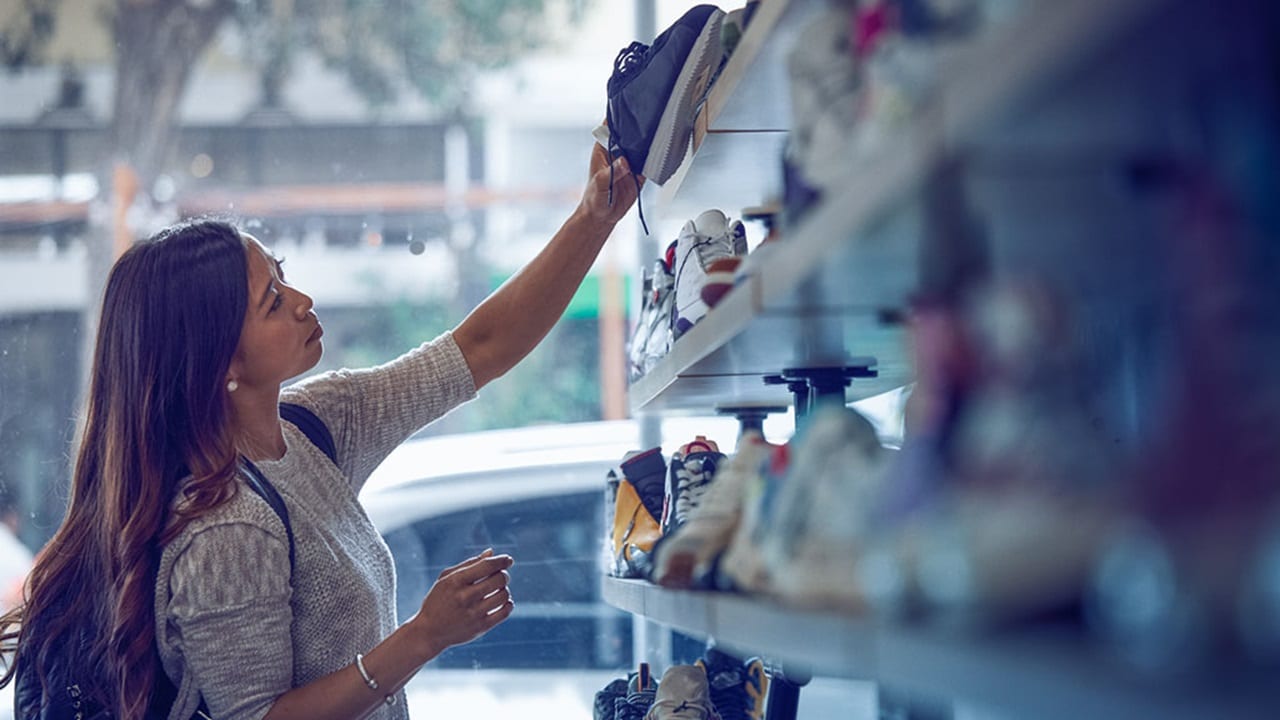 woman buying sports shoes