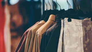 Close up shot of clothes hanging on a road in a store