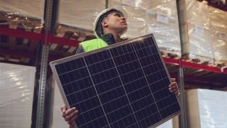 Man holding solar equipment