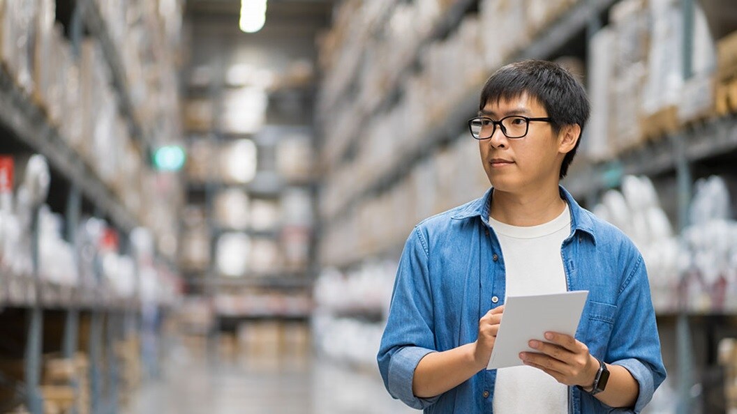 Man holding pen and paper