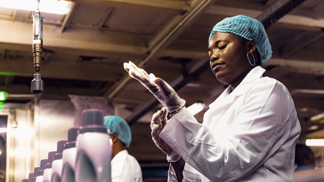 Woman working in a soap production factory 