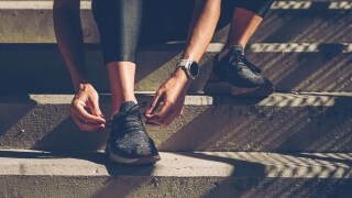 Close up shot of a pair of hands tying shoelaces