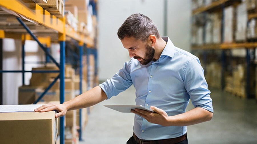 A man inspecting and checking the package