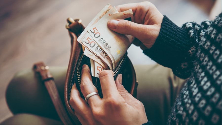 Woman holding Euro currency notes