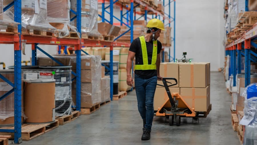 Man taking out shipments from warehouse