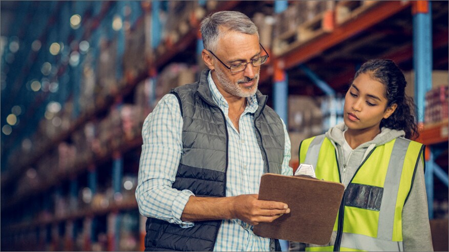 Male and a female looking at a tablet