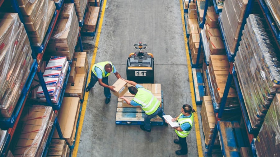 Multiple people working in a warehouse