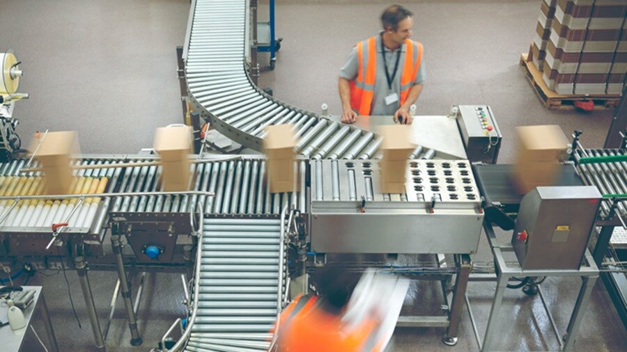 Two male working in a warehouse