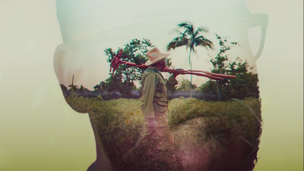Profile image of a man over imposed on a picture of a farmer in a tropical country