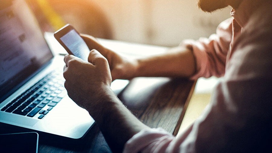 Businessman browsing phone