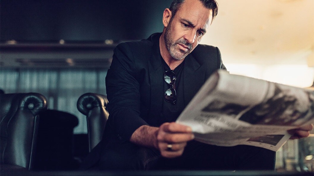 Male reading a newspaper