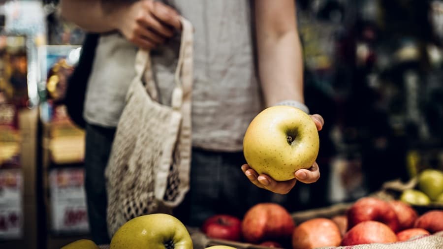 Woman holding apple