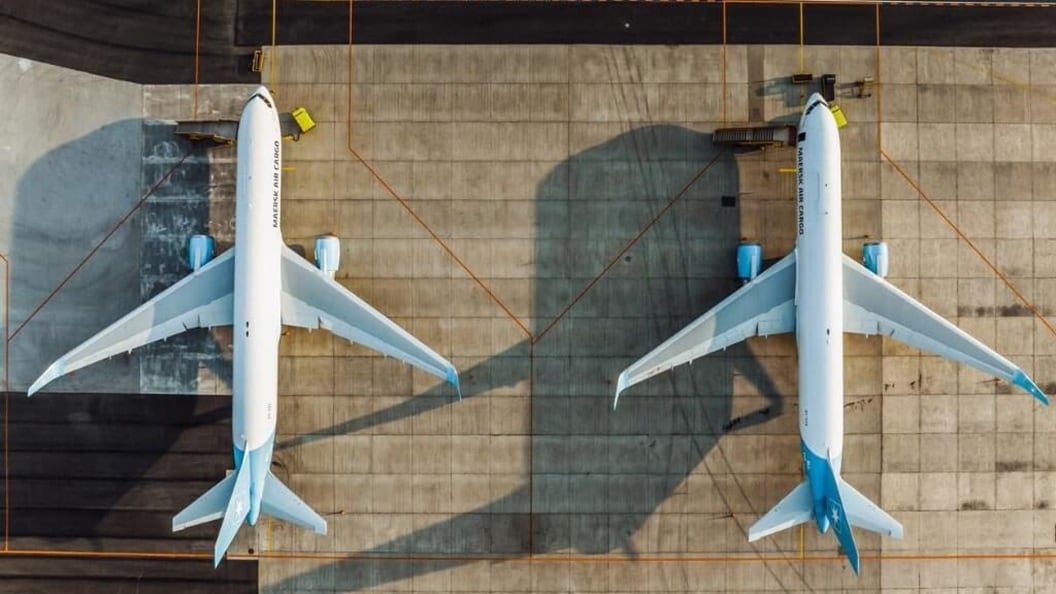 Overview shot of two plane parked on an airstrip