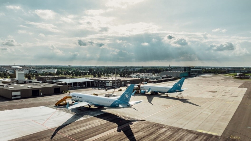 Overview shot of two plane parked on an airstrip
