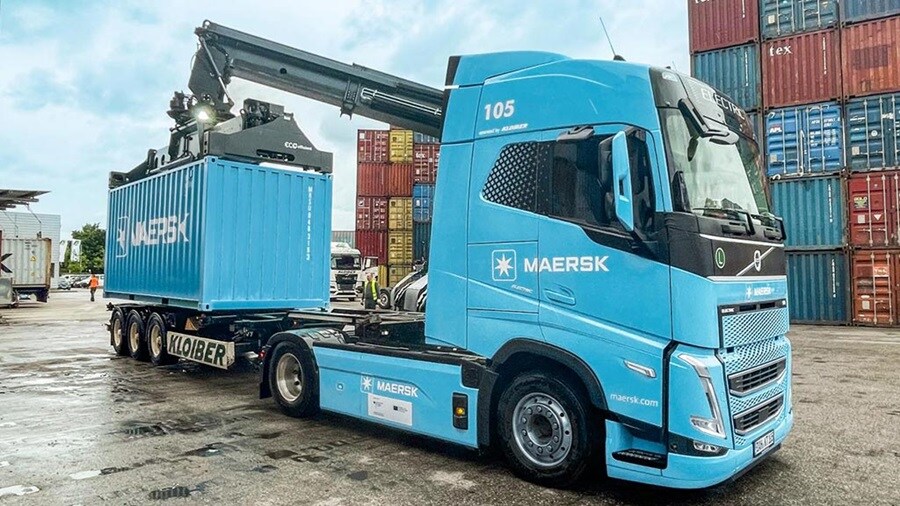 Maersk blue container being loaded on a truck