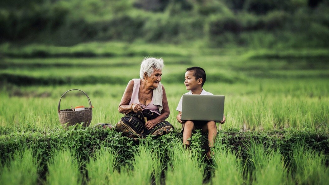 Farmer old women talking with young boy